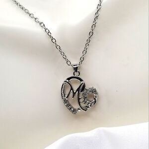 Silver toned chain pendant rhystone mom necklaces.
